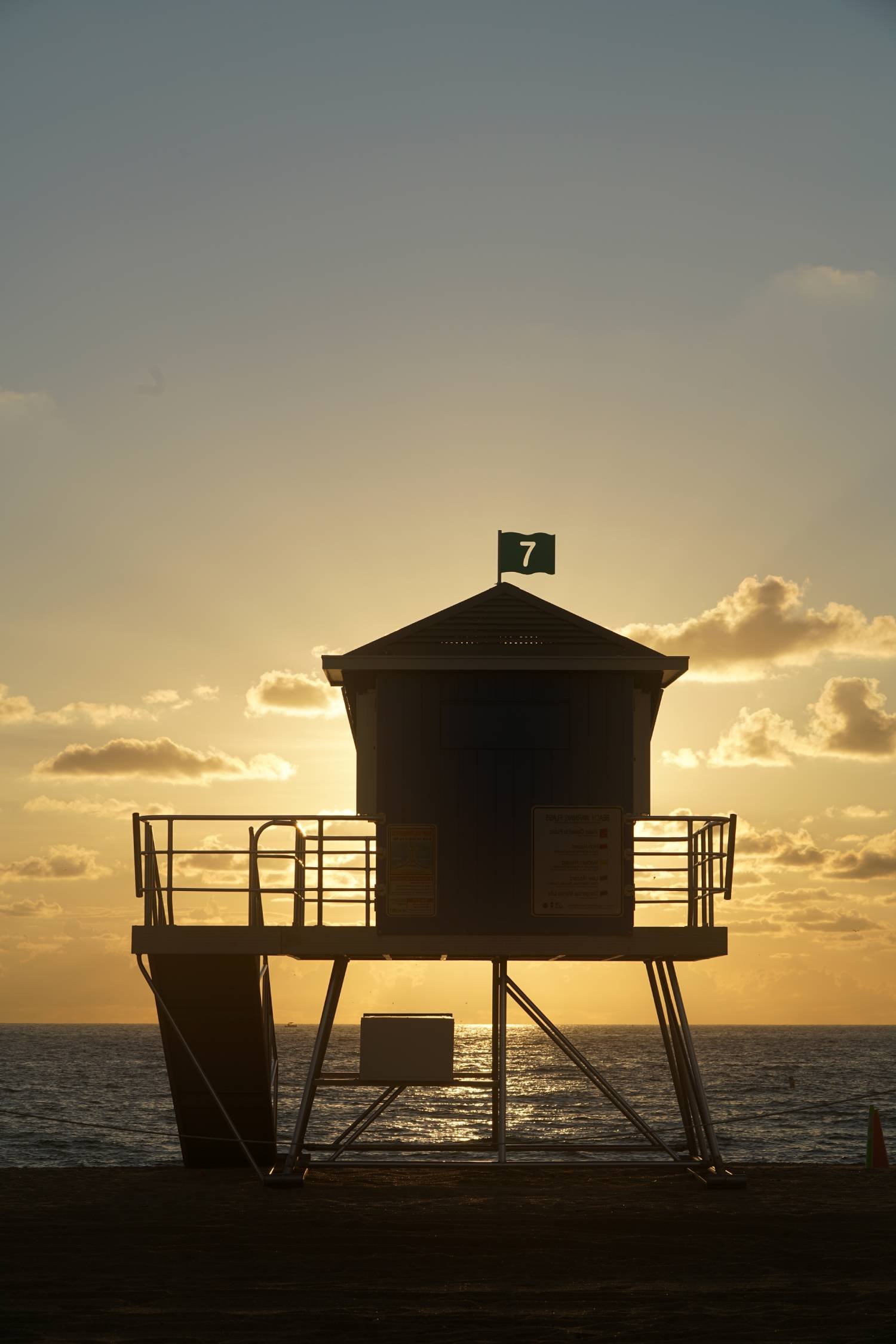 Silhouette of Lifeguard Stand at Sunset on Beach