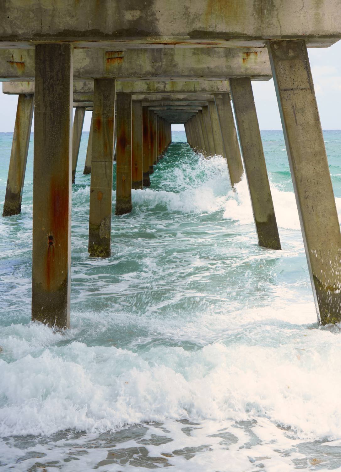 Under the Concrete Pier: Crashing Waves & Ocean View